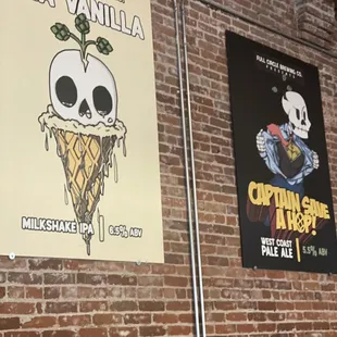 a brick wall with posters on it