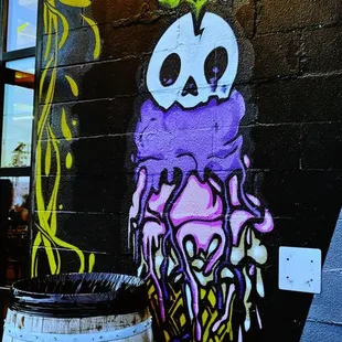 a painted skull and barrel