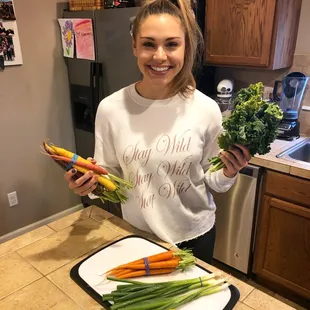 CSA box full of green onions, carrots and delicious greens!