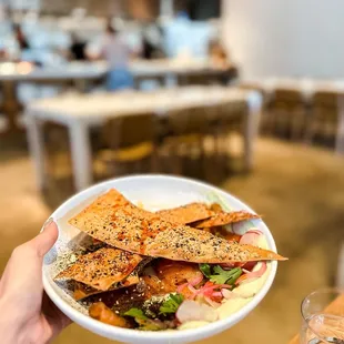 a person holding a plate of food