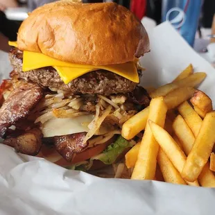 a burger and french fries in a basket