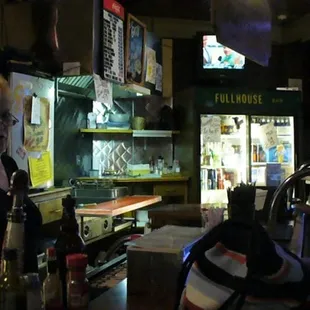 a woman standing at a bar
