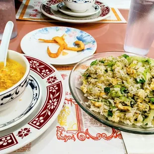 a bowl of rice and a bowl of soup on a table