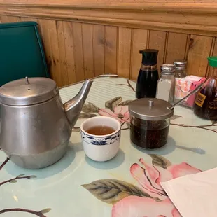 Hot tea and complimentary condiments. Fresh hot pepper oil and clean utensils, very important