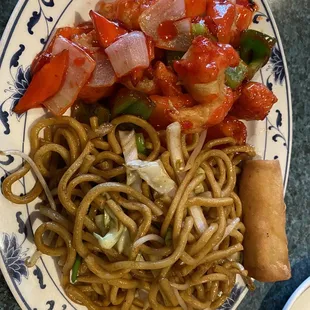a plate of noodles and vegetables