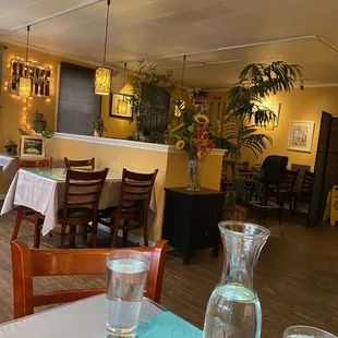 a dining room with tables and chairs