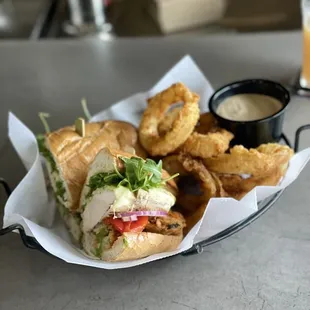Spicy chicken sandwich with onion rings and signature BBQ ranch dipping sauce.