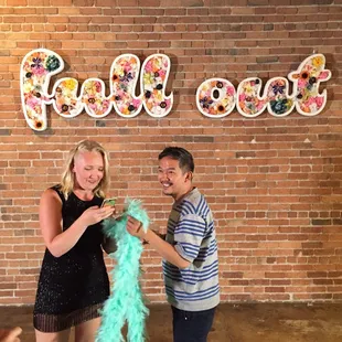 Picture in front of the Full Out sign. Located in the biggest studio.