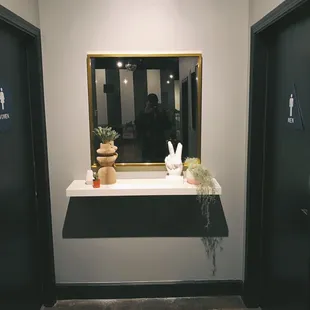 Cute mirror by the bathrooms.