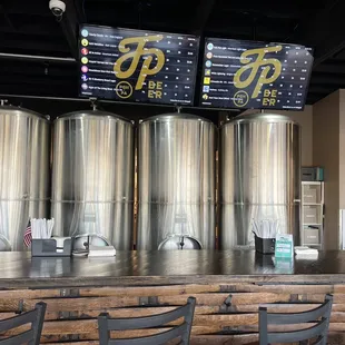 a row of stainless steel tanks