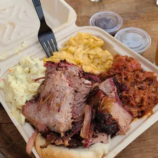 Mac and cheese, potato salad, pulled pork, and brisket