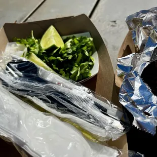 Barbacoa with the tortillas and fixings.