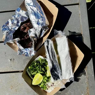 Barbacoa with the tortillas and fixings.