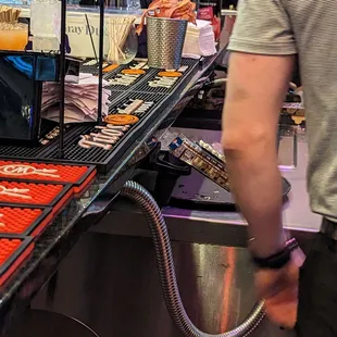 A tin of sad bacon  sitting out. I watched several waiters "brush" against this bacon. Smh