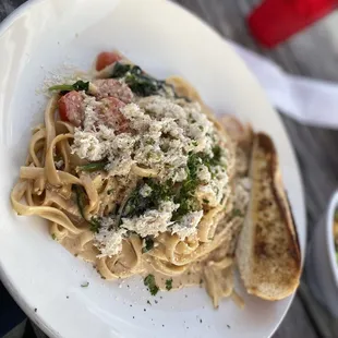 a plate of pasta and bread