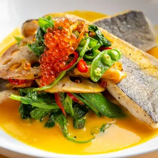 a bowl of fish and vegetables