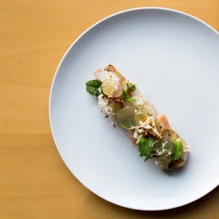 a plate of food on a wooden table