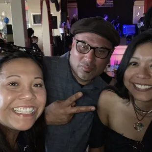 three people posing for a picture