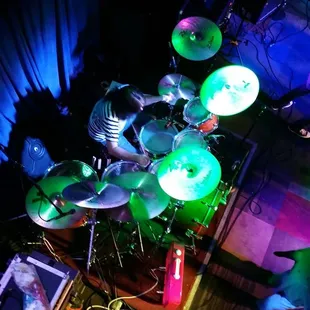 a man playing a drum set