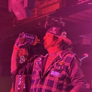 Lead singer of Kickin' Valentina in red stage lighting!