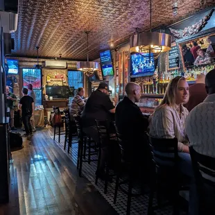 people sitting at the bar