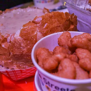 a loaf of bread and a bowl of tater tots