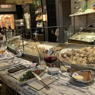 a restaurant counter with a variety of seafoods