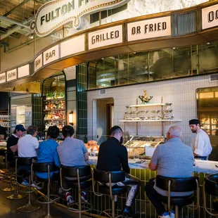 customers sitting at the counter