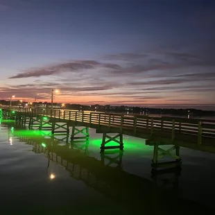 The pier all lit up at sunset