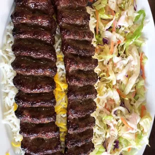 a plate of meat and coleslaw