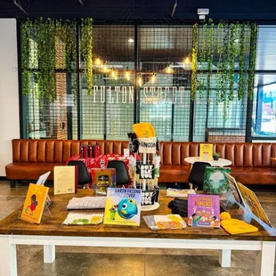 a coffee table with books and other items on it