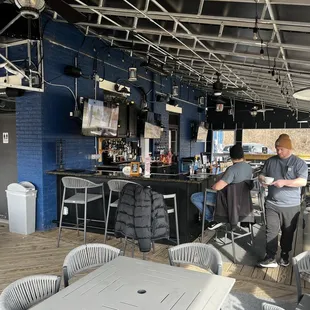 Patio at winter time- plenty warm and cozy! Lots of TVs too