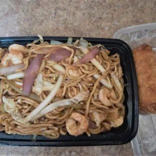 Shrimp lo mein with some weird purple strips of something on top