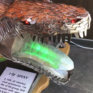 Dragon head made of forks and spoons