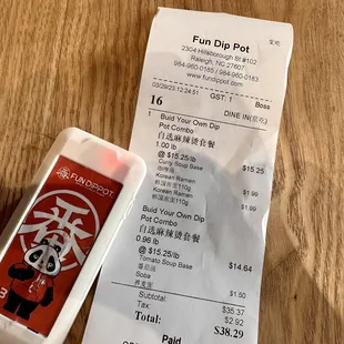 a phone and receipt on a table