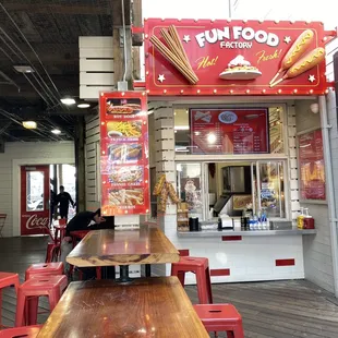 a long table with red chairs