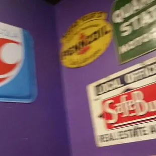 a variety of signs on the wall