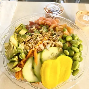 Tuna and salmon poke bowl over white rice :)