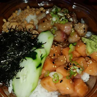 Custom build a bowl with salmon and yellowtail funko style, nori, cucumber, sesame seeds and green onions