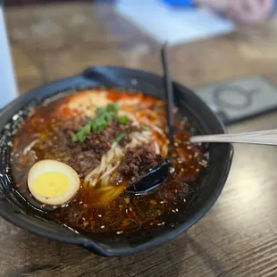 Dan Dan  30. Dan Dan Noodles were underdone, sooo much oil in the Dan Dan. The egg was yummy.
