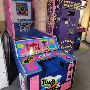 a pink and blue arcade machine