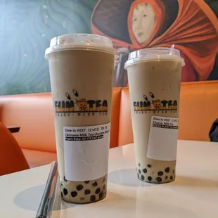 two cups of bubble tea on a table