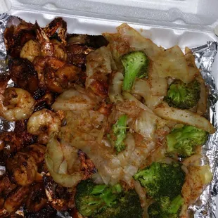 Jerk salmon and shrimp with steamed broccoli and cabbage