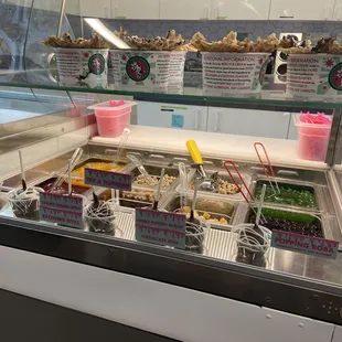 a variety of food items in a display case