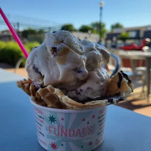 Oreo waffle bowl with pralines/blueberry cheesecake
