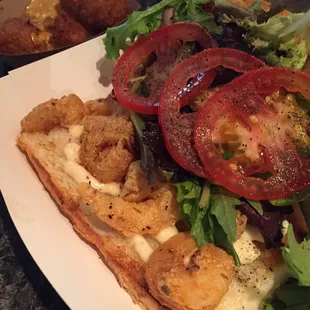 Shrimp Po Boy and (semi eaten) hush puppies.. (Both very good)