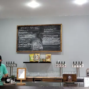 a woman standing in front of a chalkboard