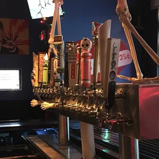 a skeleton on a beer tap