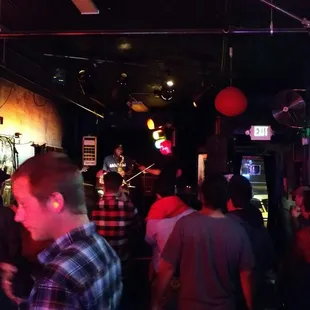 a crowd of people at a bar