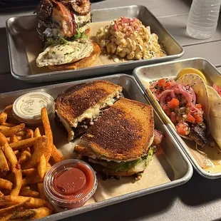 Freddy burger (front) fish tacos (right)  he built his own burger (back)